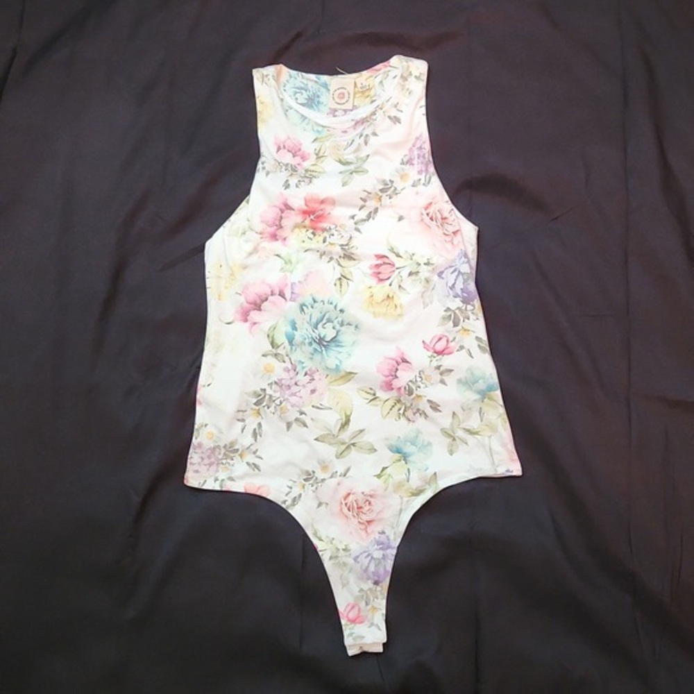 Live in the moment white body suit with soft floral print